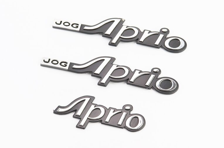 Наклейка шильдик “JOG APRIO” 13х3, к-кт 3шт